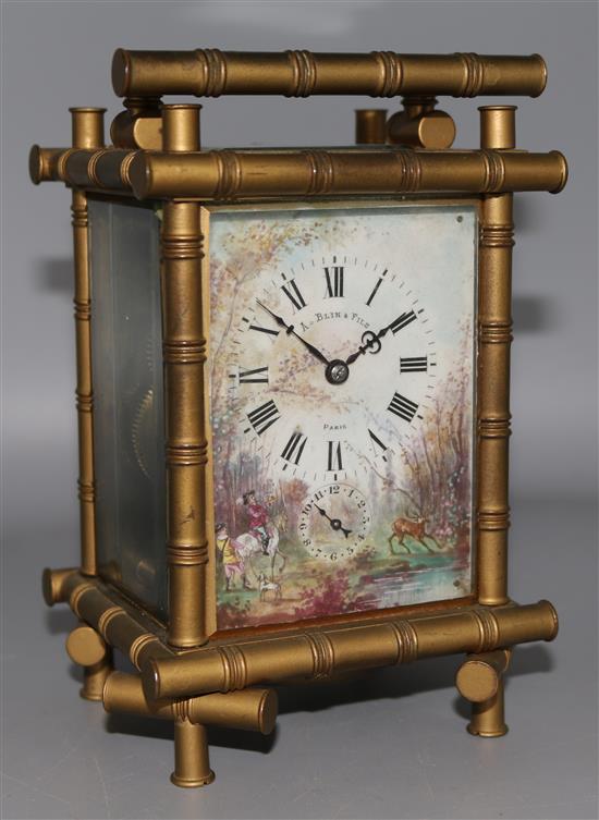 A faux bamboo design porcelain dial carriage clock